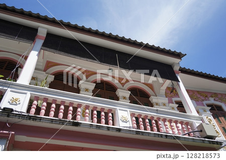 Detailed view of windows, doors and balconies of city buildings  128218573