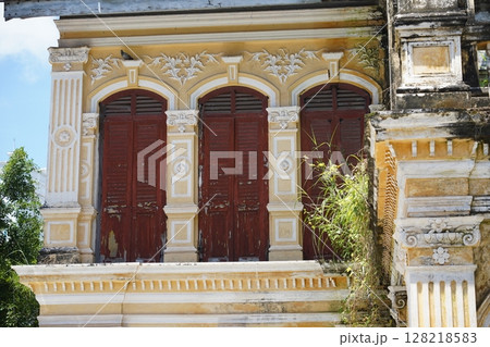Detailed view of windows, doors and balconies of city buildings  128218583