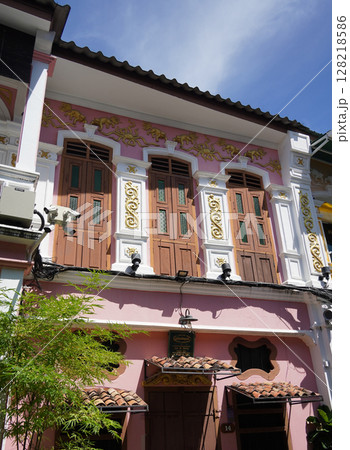 Detailed view of windows, doors and balconies of city buildings  128218586