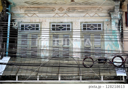 Detailed view of windows, doors and balconies of city buildings  128218613