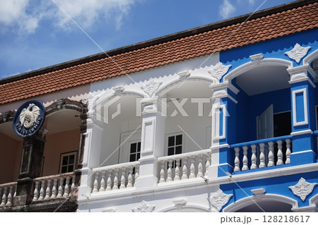 Detailed view of windows, doors and balconies of city buildings  128218617