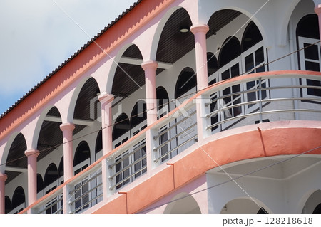 Detailed view of windows, doors and balconies of city buildings  128218618