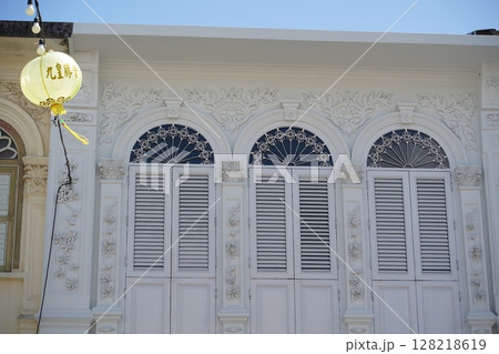 Detailed view of windows, doors and balconies of city buildings  128218619