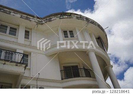 Detailed view of windows, doors and balconies of city buildings  128218641