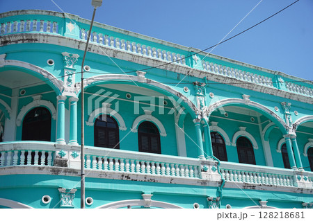 Detailed view of windows, doors and balconies of city buildings  128218681