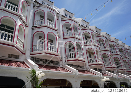 Detailed view of windows, doors and balconies of city buildings  128218682