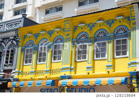 Detailed view of windows, doors and balconies of city buildings  128218684