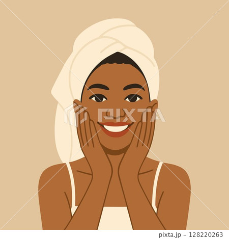 smiling woman with towel on head touching face 128220263
