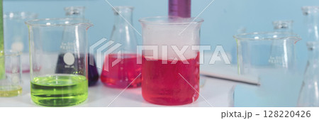 Banner Science chemistry glass tubes object on lab background. Wide Liquid tube biology laboratory chemical fluid scientist object medical glass tubes. Chemistry scientific background with Copy Space 128220426