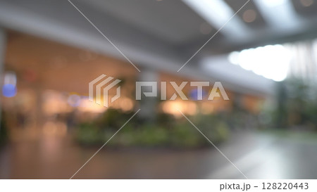 Blurred background bright shopping mall Silver gray lighting. defocused store light bokeh in retail store. Blurry hospital bright softness hotel with copy space. Backdrop present design template. 128220443