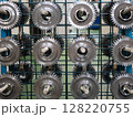 Industrial gears on factory rack. Precision engineering and manufacturing concept 128220755