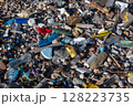 Plastic bottles and garbage polluting a pebble beach 128223735