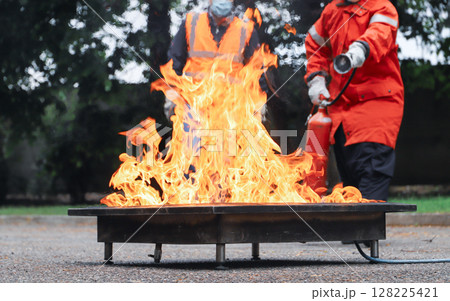 corporate safety - exercise during a firefighting course 128225421