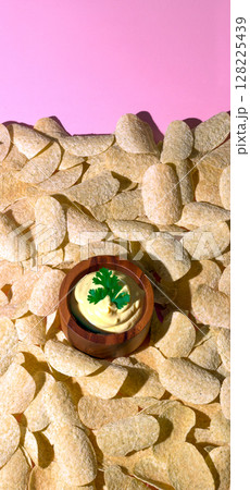 Potato Chips and Creamy Dip on Pink Background 128225439