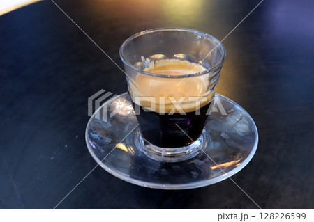 There is hot black coffee in a glass 128226599