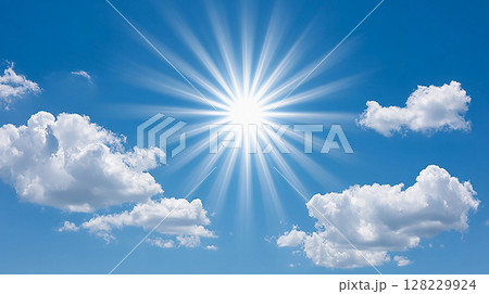 Bright sunlight radiates in a clear blue sky with fluffy white clouds during a serene afternoon 128229924