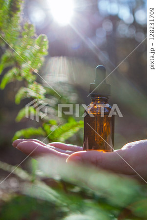 Amber Glass Dropper Bottle with Sun Flare 128231709