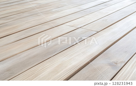 Natural wooden floor with smooth planks and light finish in a cozy interior setting 128231943