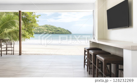 Beautiful beachfront view from modern coastal interior with seating area 128232269