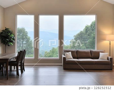 Spacious living area with mountain views and natural light in a modern home Spacious living area with mountain views and natural light in a modern home 128232312
