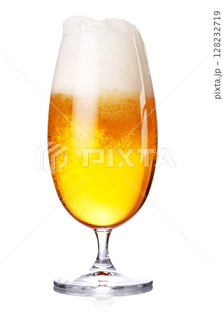 A glass of beer with a golden hue and frothy head, isolated on a clean white background 128232719