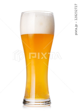 A glass of beer with a golden hue and frothy head, isolated on a clean white background 128232727