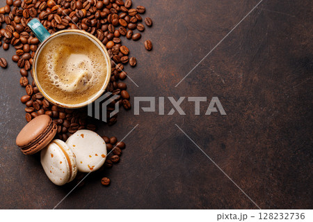 A steaming cup of freshly brewed coffee surrounded by rich, aromatic roasted coffee beans A steaming cup of freshly brewed coffee surrounded by rich, aromatic roasted coffee beans 128232736