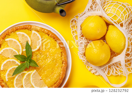 Delicious lemon tart with golden crust and smooth, glossy lemon filling Delicious lemon tart with golden crust and smooth, glossy lemon filling 128232792