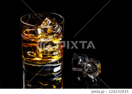 A refined glass of whiskey on the rocks 128232835