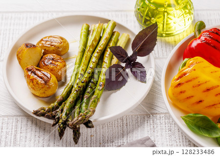 Grilled asparagus and golden baby potatoes 128233486