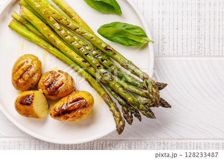 Grilled asparagus and golden baby potatoes 128233487