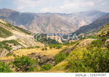 A mountain range with a valley in between A mountain range with a valley in between 128234397
