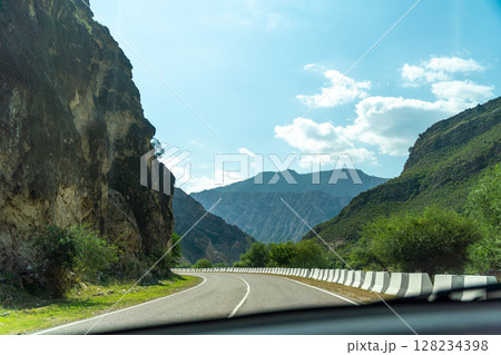 A road with a mountain in the background A road with a mountain in the background 128234398