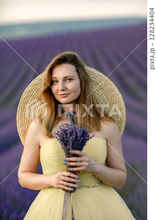 Lavender woman portrait, lady holds flowers on a summer day in field for joy, love. Lavender woman portrait, lady holds flowers on a summer day in field for joy, love. 128234404