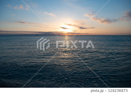 beautiful morning skyscape with sea water on the summer beach 128236873