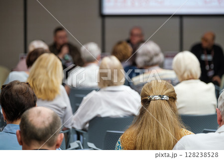 Group of people attending a community discussion and presentation 128238528