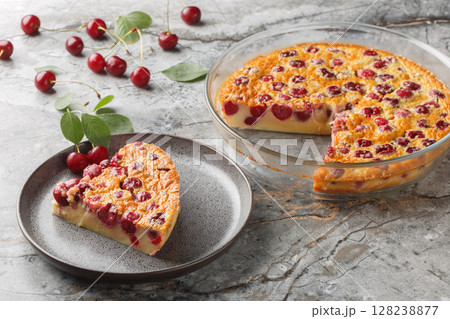 slice of cherry pie clafoutis simple summer dessert close-up in a plate. Horizontal slice of cherry pie clafoutis simple summer dessert close-up in a plate. Horizontal 128238877