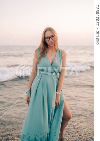 Woman in Flowing Dress on Seaside Pier 128238921
