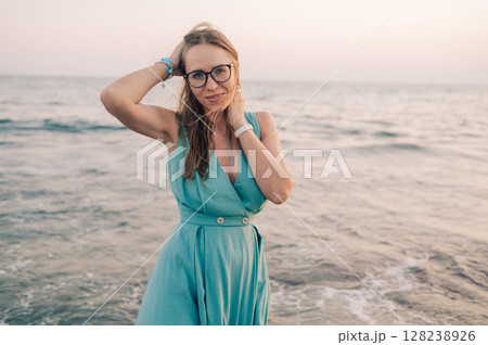 Woman in Flowing Dress on Seaside Pier 128238926