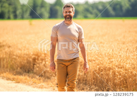 Hispanic man farmer check agriculture field harvest. Man agronomist farmer. Crop protection. Agriculture farm. Farm man at wheat field. Crop harvest and farming. Farmer in field 128239175