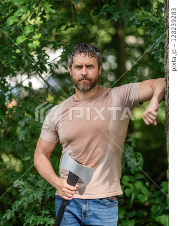 Sweating guy relax. Handsome man with axe. Lumberjack in woods with an ax. Lumberjack in shirt with heavy axe. Strong man work in forest. Lumberjack men in forest with axe. Lumberjack carries axe Sweating guy relax. Handsome man with axe. Lumberjack in woods with an ax. Lumberjack in shirt with heavy axe. Strong man work in forest. Lumberjack men in forest with axe. Lumberjack carries axe 128239283