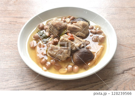 boiled chop pork bone with peanut and black mushroom soup on plate boiled chop pork bone with peanut and black mushroom soup on plate 128239566