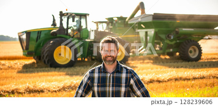 Agricultural wheat at harvest time. Countryside crop. Agronomist man at crop field. Ripe agriculture. Harvest man at field. Farmer agronomist. Crop harvest. Farmer check wheat. Experienced farmer 128239606