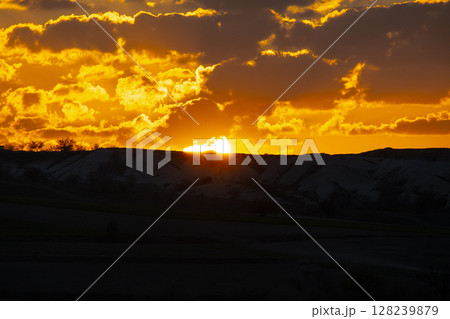 dramatic sunset sky with clouds and sun 128239879