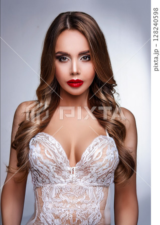 Elegant Woman in Lace Bralette and Gloves 128240598