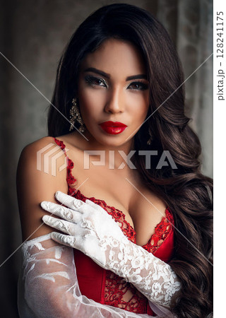 Elegant Woman in Silk Camisole and Gloves 128241175