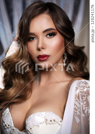 Elegant Woman in Silk Camisole and Gloves 128241176