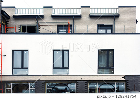 Construction of a new modern building in winter 128241754