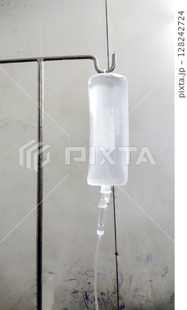 Medical IV Drip Hanging on Stand in Hospital Room Medical IV Drip Hanging on Stand in Hospital Room 128242724