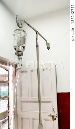 Medical IV Drip Hanging on Stand in Hospital Room Medical IV Drip Hanging on Stand in Hospital Room 128242733